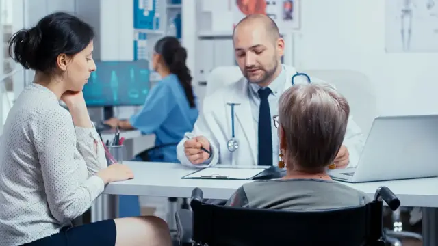 woman wheelchair her daughter annual doctor appointment selective focus disability disabled treatment elderly disabled hospital or private clinic modern medicine healthcare